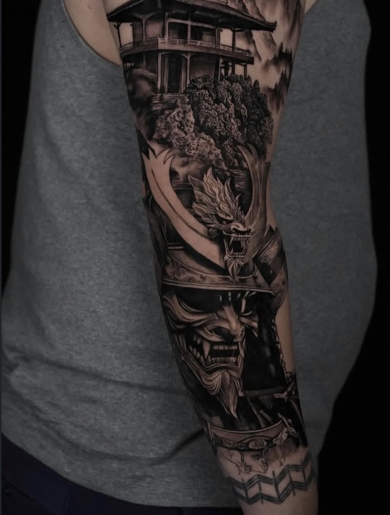 Black and grey samurai mask and pagoda forearm sleeve tattoo by Sandra