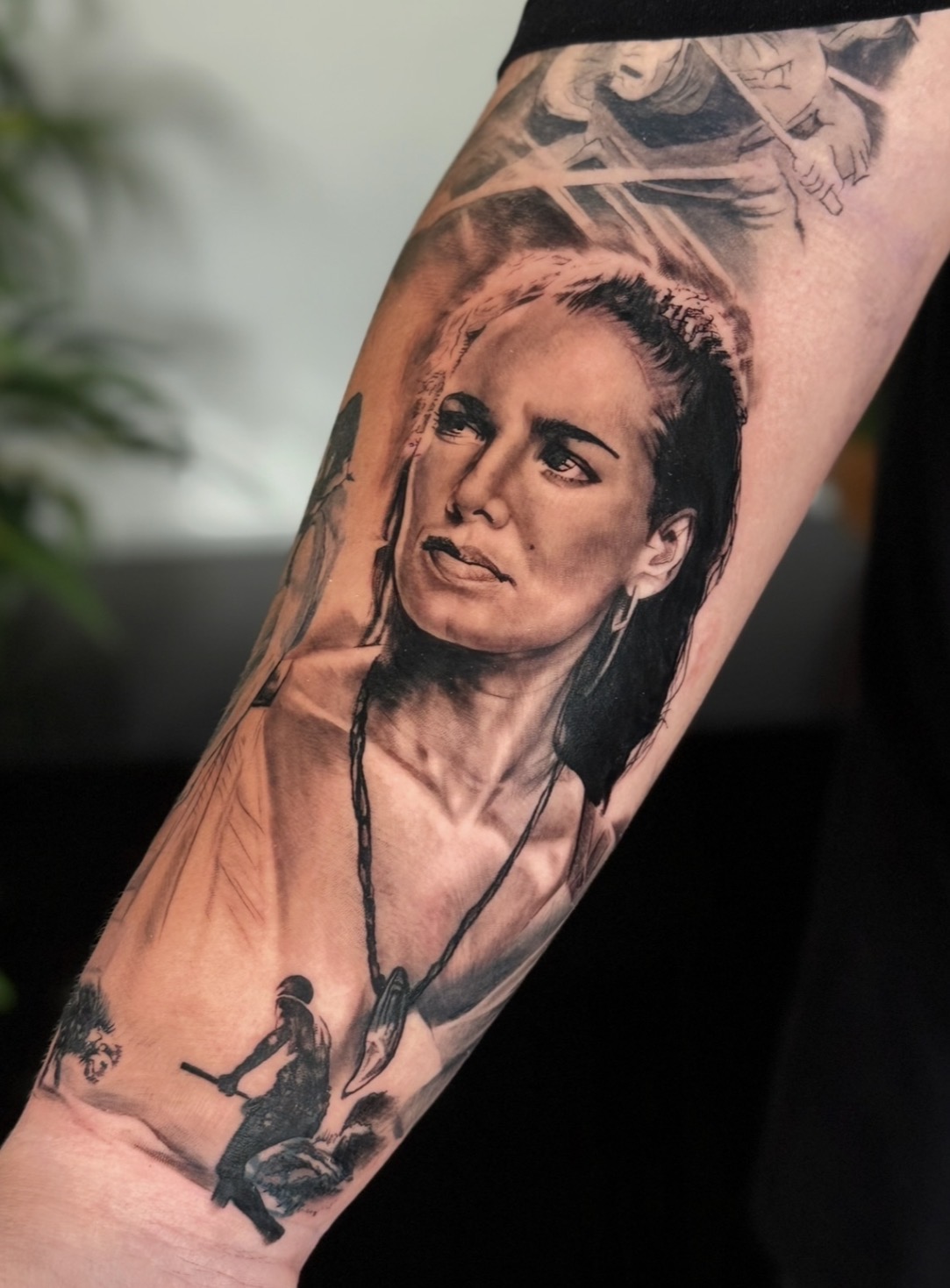 Black and grey realism woman portrait forearm tattoo by Sandra